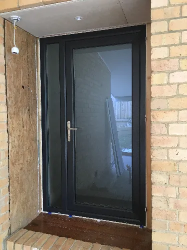 Grey double glazed uPVC front entry door